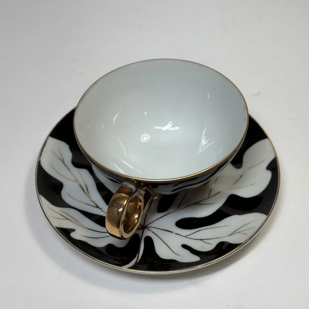 Footed Tea Cup and Saucer Black White Gold Leaf MCM Holywood Regency Art Deco
